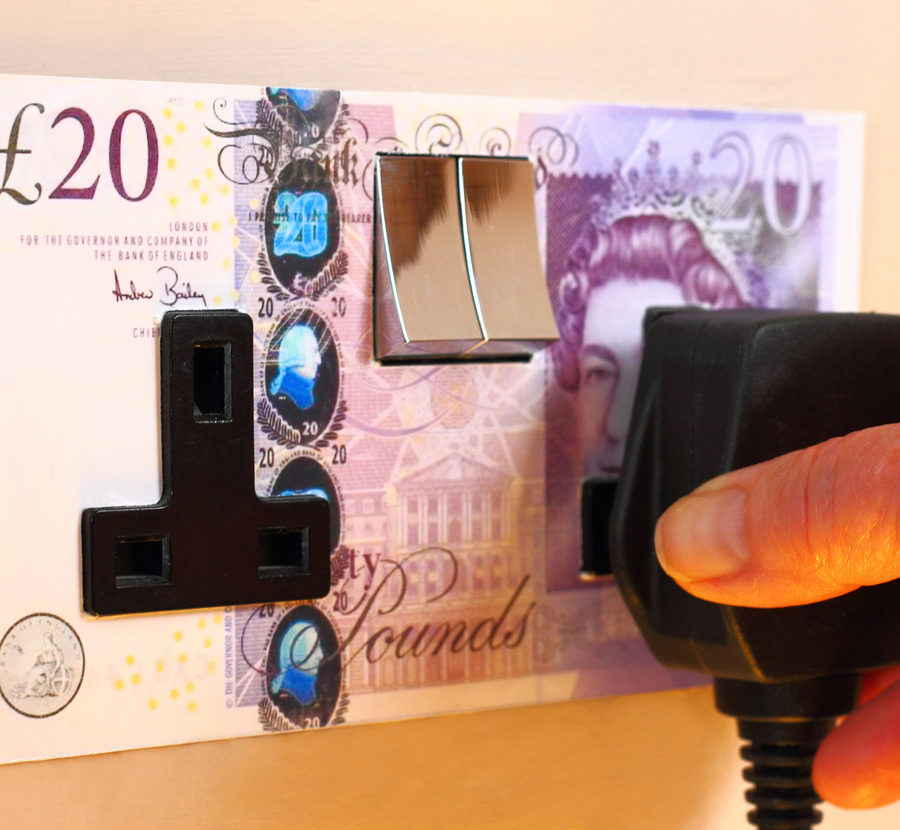 Plug socket surrounded by £20 note