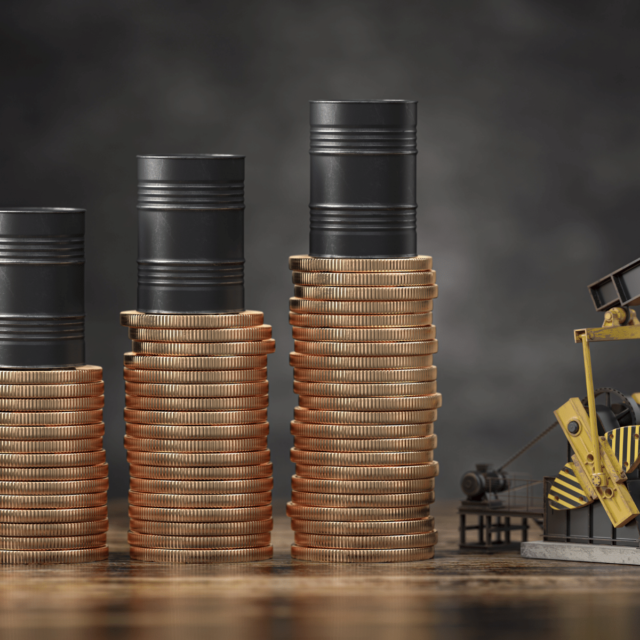 Coins and oil barrels signifying profits