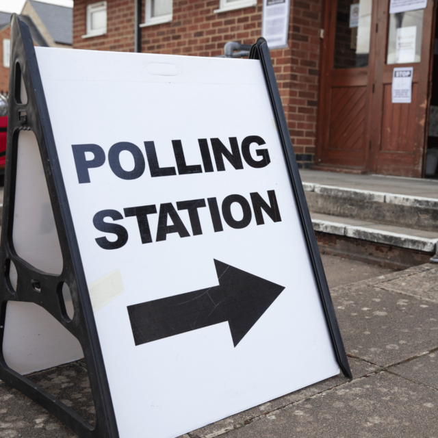 Sign directing people into a polling station